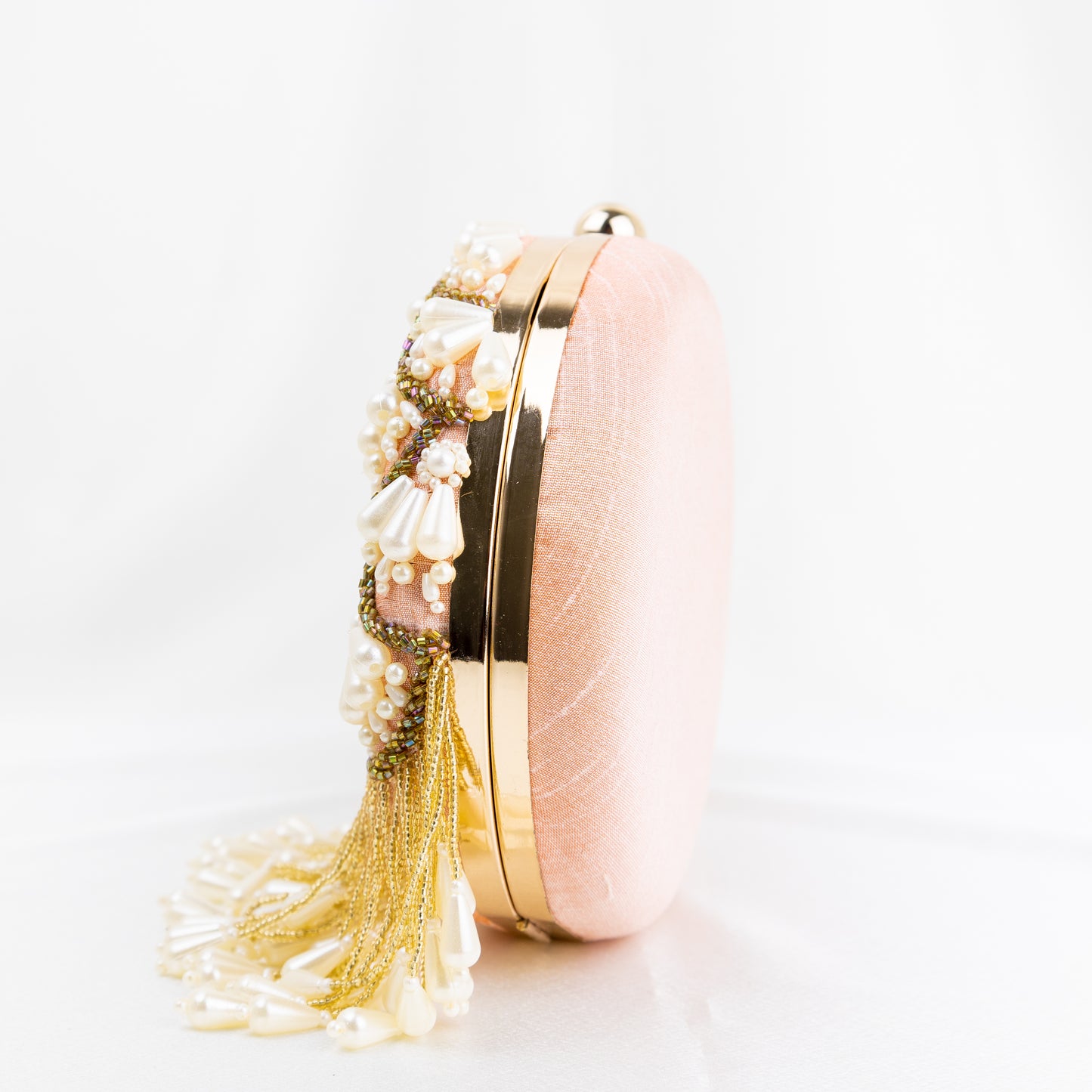 Pearl Elegance: Peach Round Clutch with Golden Embroidery and Lustrous Pearls